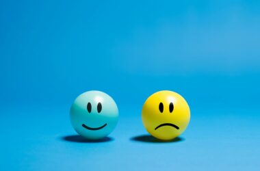 contrasting emotions on smiley balls