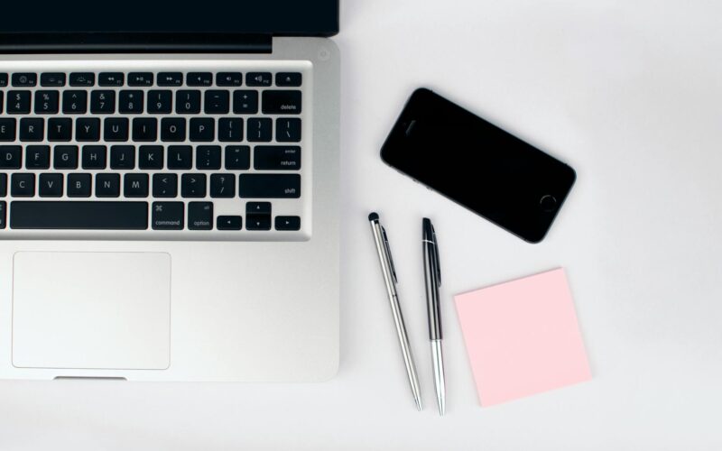 two pens beside macbook