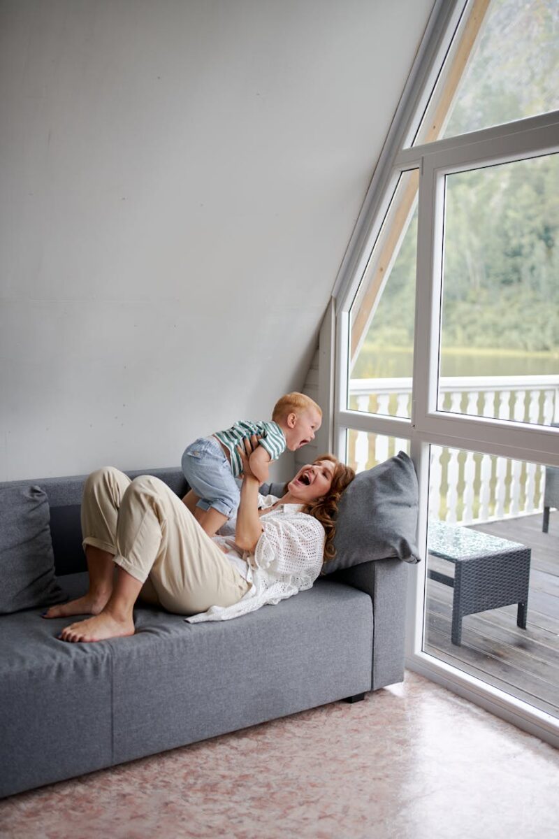 mother and baby having fun playing in the living room