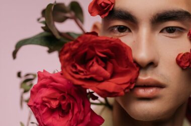 portrait of a handsome man with red roses