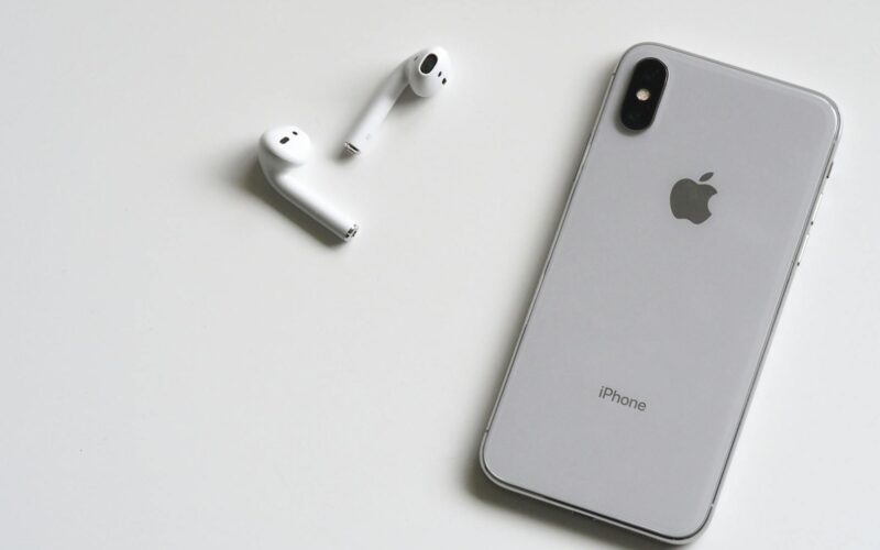 silver iphone x with airpods